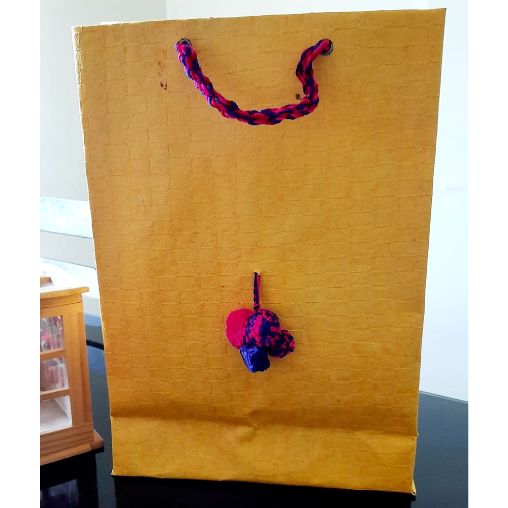 YELLOW WITH PINK POMPOM PAPER BAG